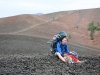 Joe hiding the kids from the elements (wind and rain) while I run up for a peek at the summit.